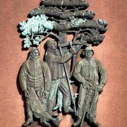 Fisherman, farmer, miner, and tree ... symbolizing the main industries of the municipality.