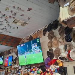 Hats on walls and roof. Wellshot Hotel