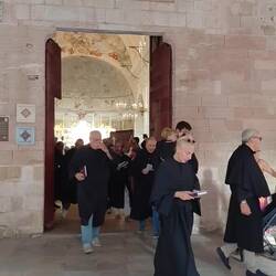 Corsica celebrates religious days regularly. Note the young denim clad bearers in runners