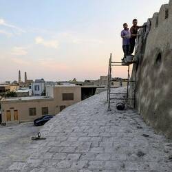 On top of the parapet, refreshing the plaster