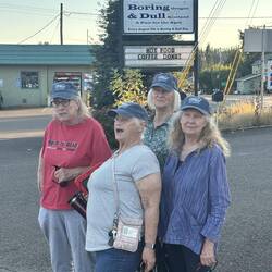 The Wild Women posed for a photo in front of the sign