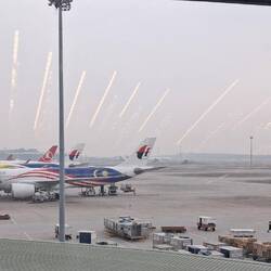 KL airport. The 'shooting stars' are reflections of the internal lights.
