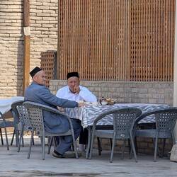 Two old men enjoying their tea break