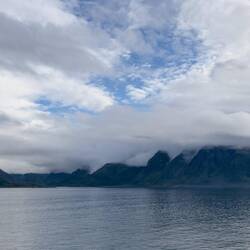 Mountains and clouds en route to Øksfjord.