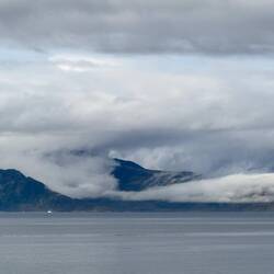 Mountains and clouds en route to Øksfjord.