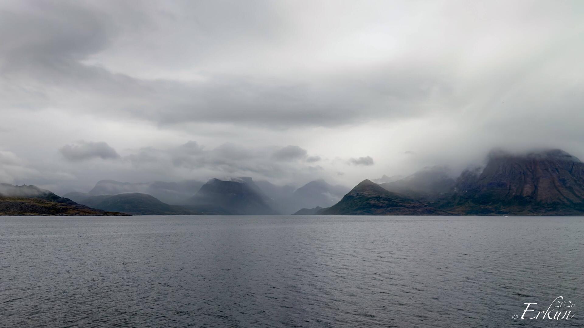 Mountains and clouds en route to Øksfjord.