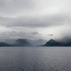 Mountains and clouds en route to Øksfjord.