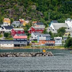 Øksfjord and a glimpse of its church.