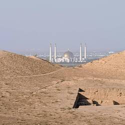 View of the Turkmenbashi's mosque and mausoleum through the gaps in the fortress wall