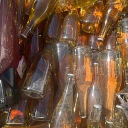 Glass bottles in a bin. It is still an industrial area