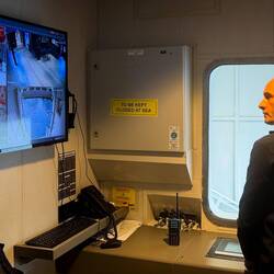 Tom from Customer Service invites Mui into the control room for the passenger gangway.