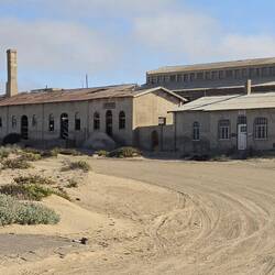 Derelict buildings greet you