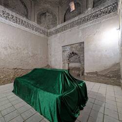 Merv - tomb is draped in a vibrant green velvet cloth even if no evidence of the body being buried