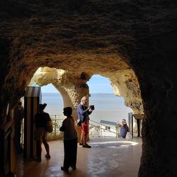 View through the grottos that were formed in the cliff