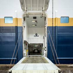 Looks like we're carrying a car, too ... in the cargo compartment rather than on deck.