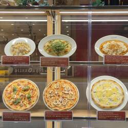 Even the Italian restaurant shows faithful plastic replicas of its meals