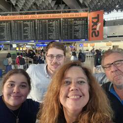 Exhausted at Frankfurt in front of the departure board where we met up 3 weeks ago