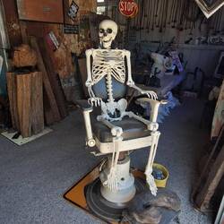 Skeleton in an old dentist chair