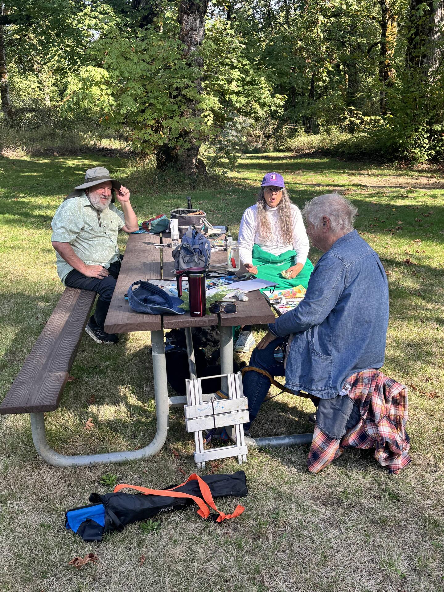 Li, Sherwood and Jill at the painters table