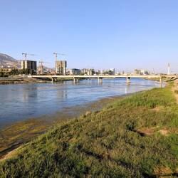 River in the evening sun, with loads of unfinished tower blocks