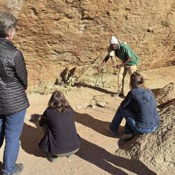 The guide explains about the rock paintings
