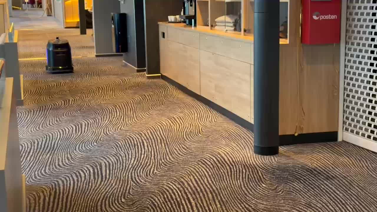 Olga the robot carpet sweeper on her way to her charging point on m/s Havila Castor.