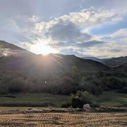 Sun dipping below the hills on the way to Karakol