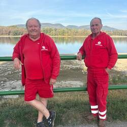 2 Hungarian ambulance drives taking a smoke break.