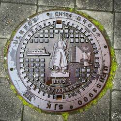 Manhole cover in Kristiansund; 1742 is when city status was granted.