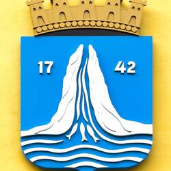 Coat of Arms — river flowing between two cliffs to the sea; salmon swimming upstream — Kristiansund.