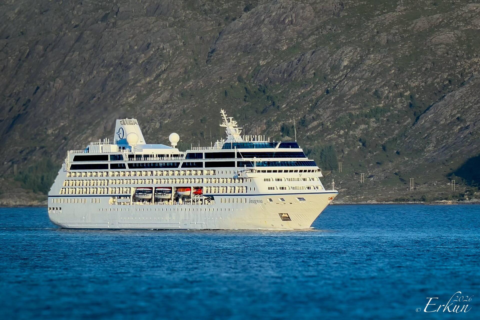 While enjoying his coffee, Mui saw Insignia passing ... the ship on which we did two world cruises.
