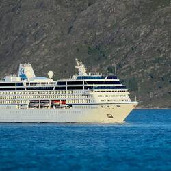 While enjoying his coffee, Mui saw Insignia passing ... the ship on which we did two world cruises.