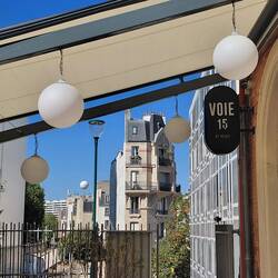 The old railway station, now Cafe Voie 15, note the tethered balloon in the distance