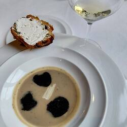 Artichoke and black truffle soup with brioche and whipped truffle butter