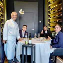 Guy with his grandson on his left and his friends