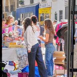 Young girls selling their unwanted belongings at the flea market