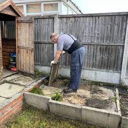Taking up pavers from the old garden steps.