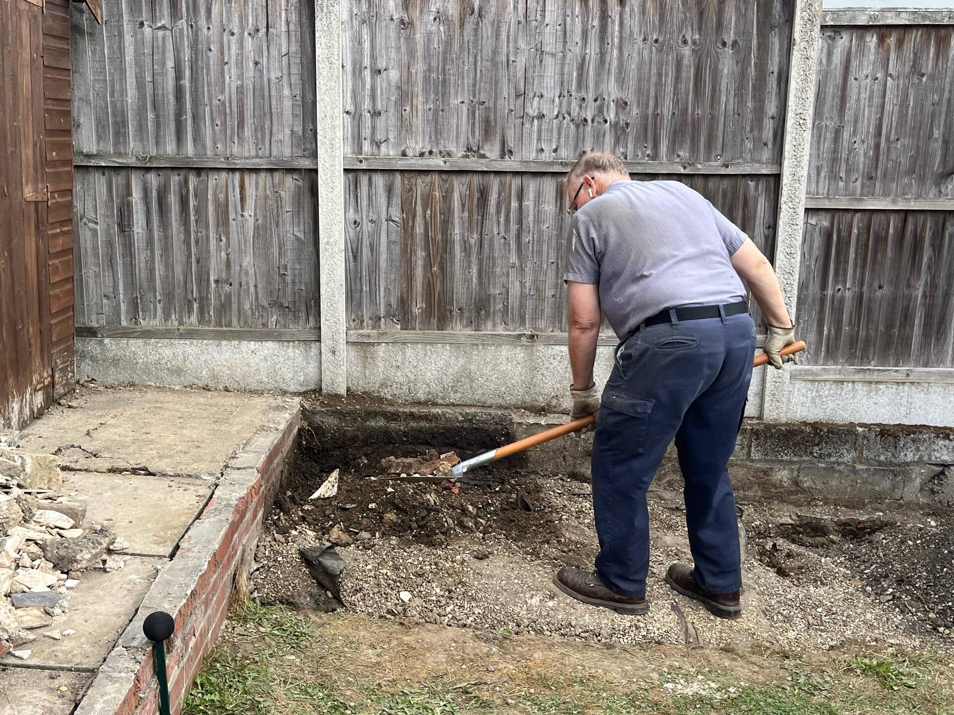 Digging up dirt for temporary ramp.