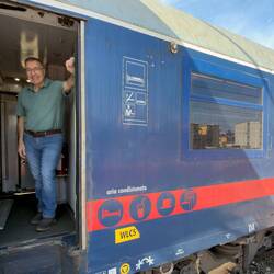 Getting some fresh air at the door of our sleeper car — Villa San Giovanni Station.