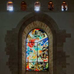 Modern rose window; the small openings are along the walkway between the towers — Duomo di Cefalù.