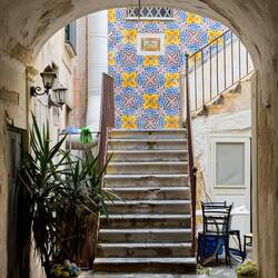 Through an archway in Old Town — Cefalù, Sicily.