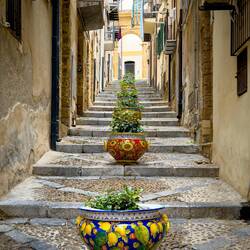 Vicolo Caracciolo is known for the colorful ceramic pots that run down its middle.