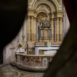 Peeking through an iron gate into the Chapel of the Blessed Sacrament — Duomo di Siracusa.