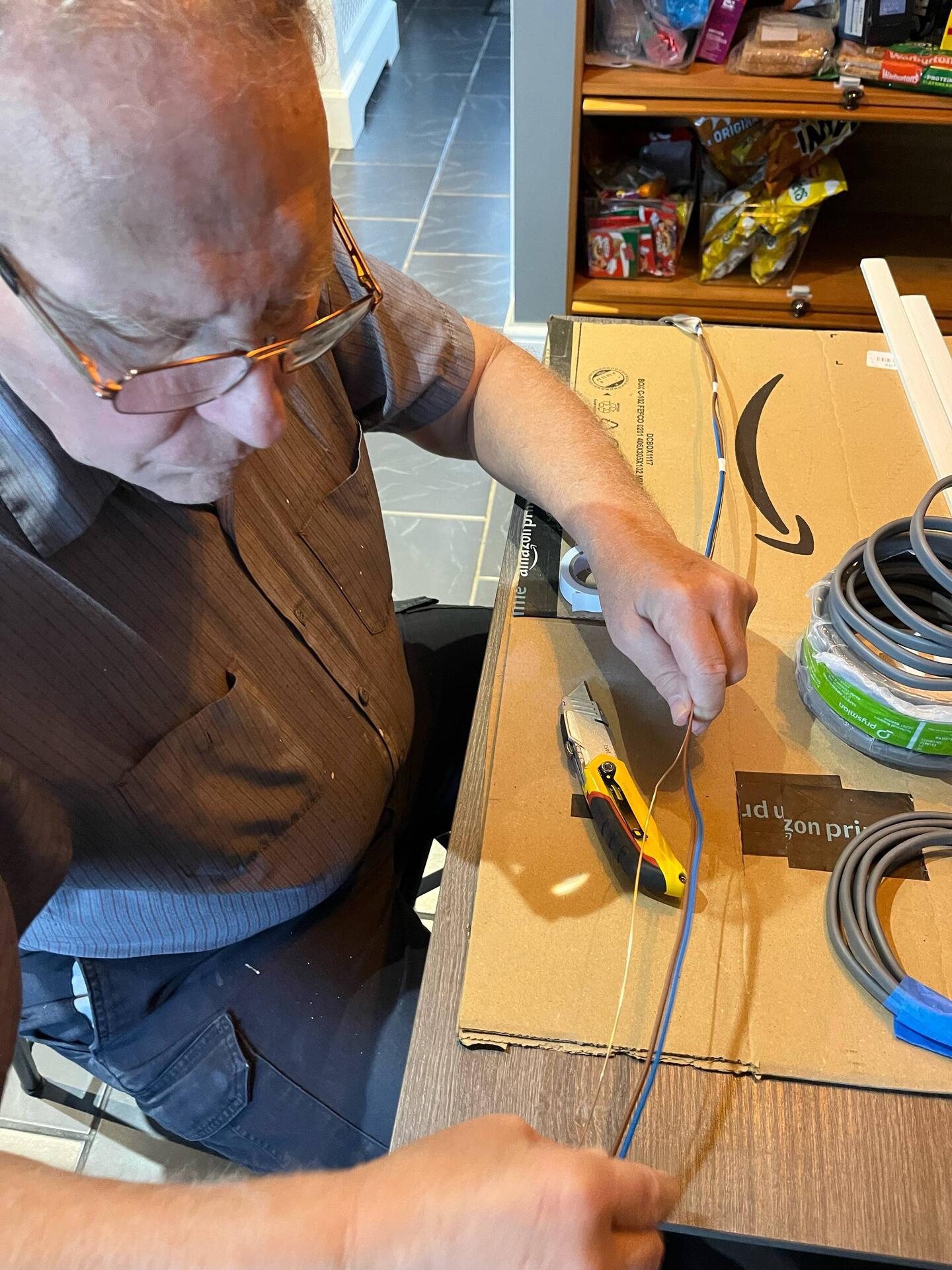 Preparing three wires to fit into the track.