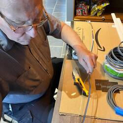Preparing three wires to fit into the track.