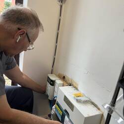 Connecting the wires to the breaker box.