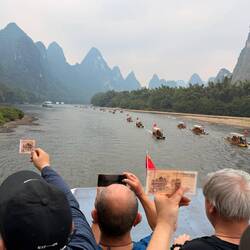 Locals try to photo the spot it represents