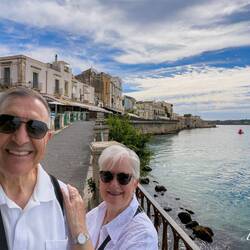 At the far end of the promenade is Castello Maniace — Ortigia Island.