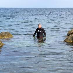 Taking a dip at Cala Rossa Beach on Ortigia Island.