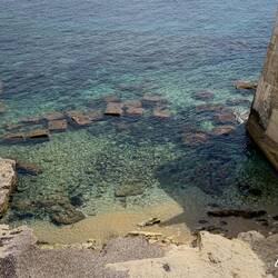 Crystal clear water ... viewed from the bridge crossing the moat — Castello Maniace.